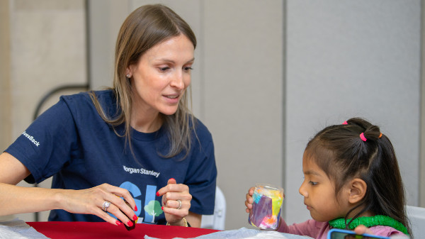 Staci Piken and a young visitor build lanterns