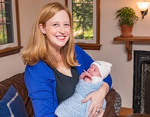 lauren Kuratko holding her baby