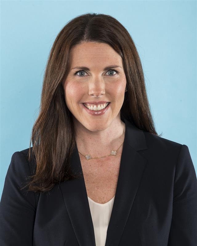 Woman in a navy top.
