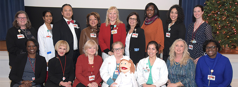 a group of people posing for a photo