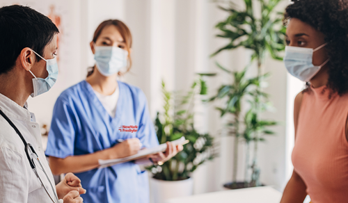 NYP staff communicating with a patient