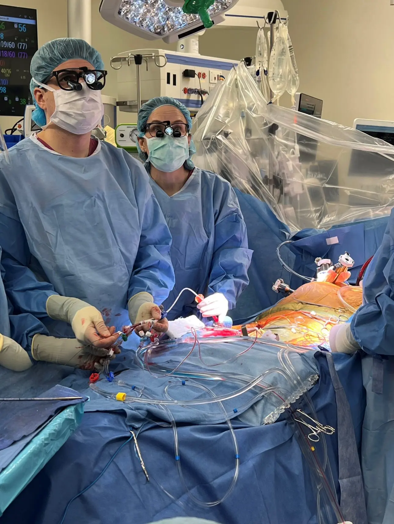 Dr. Mick (right) and a trainee perform an endoaortic balloon occlusion during robotic mitral valve surgery.  