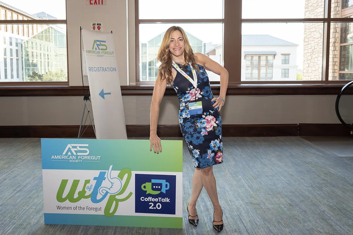 Dr. Schnoll-Sussman posing with Women of the Foregut sign.